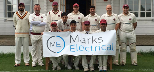 Cricketers hold up sponsor sign