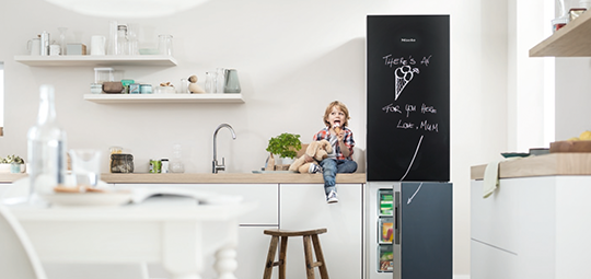 Miele Blackboard scene with child